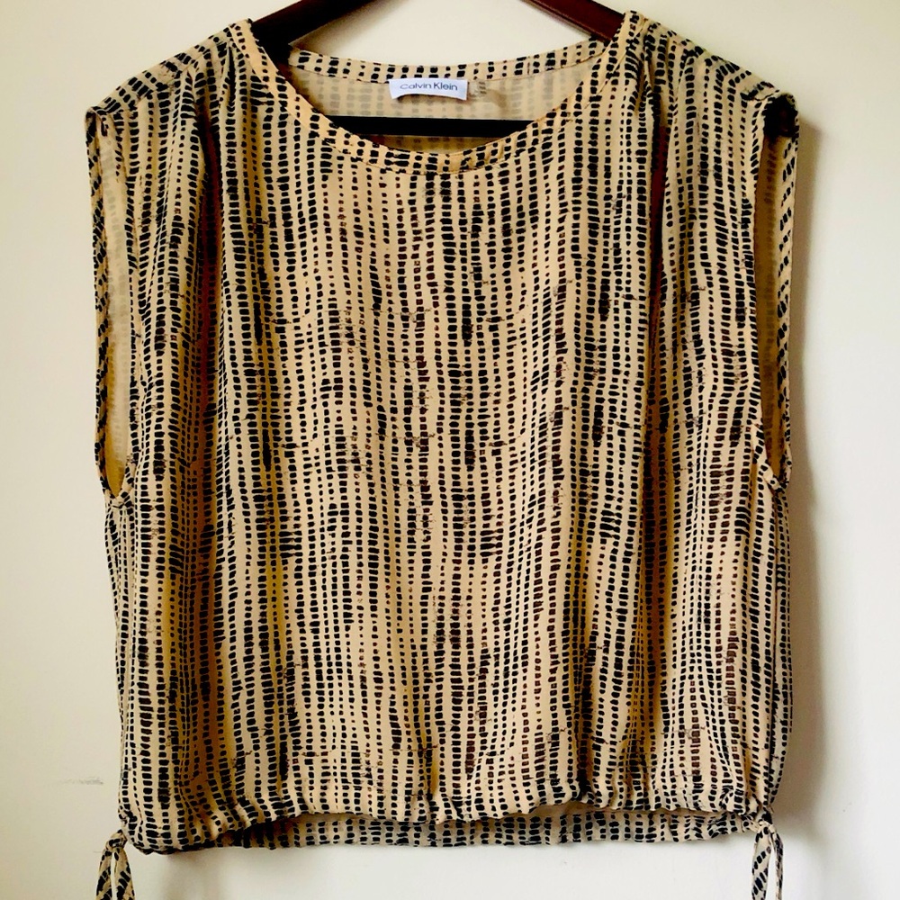 Calvin Klein Woman’s Blouse. Sleeveless with elastic waist ties.